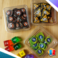 Three boxes with tokens and colourful dice
